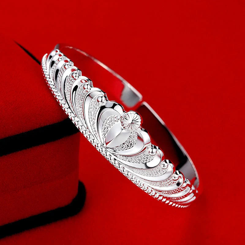 Women's silver electroplated crown bracelet with detailed design