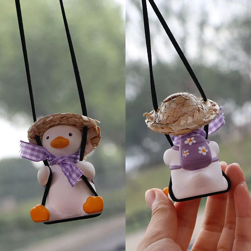 Car Swing Duck Ornament hanging from rearview mirror