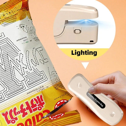 Compact USB mini sealing machine for kitchen food preservation in black and milky white