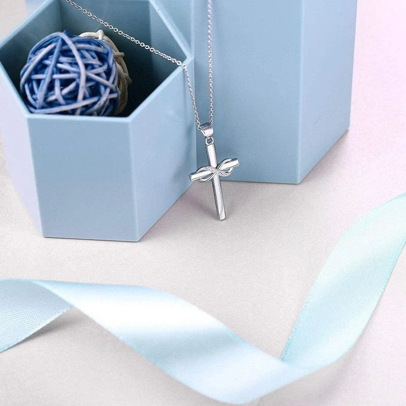 Elegant cross and infinity symbol pendant necklace in gold and silver tones, made with premium materials for a sophisticated and long-lasting accessory.