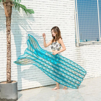 Mermaid-inspired inflatable pool lounger in vibrant blue and pink colours, offering a comfortable and stylish water relaxation experience.