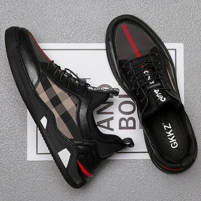 A pair of men's casual leather shoes with a sleek, lace-up design and a stylish check pattern.