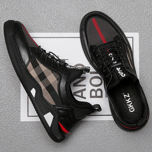 A pair of men's casual leather shoes with a sleek, lace-up design and a stylish check pattern.