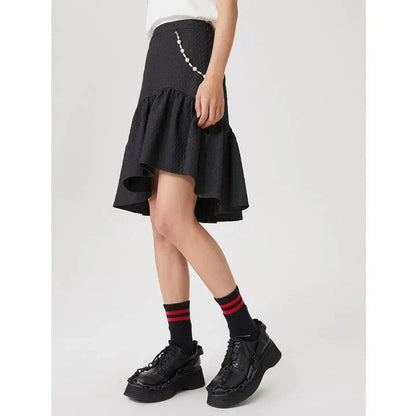 Metersbowne Jacquard Swallowtail Half Skirt Shorts in Black, featuring an embossed fabric design and a flattering silhouette for summer style.