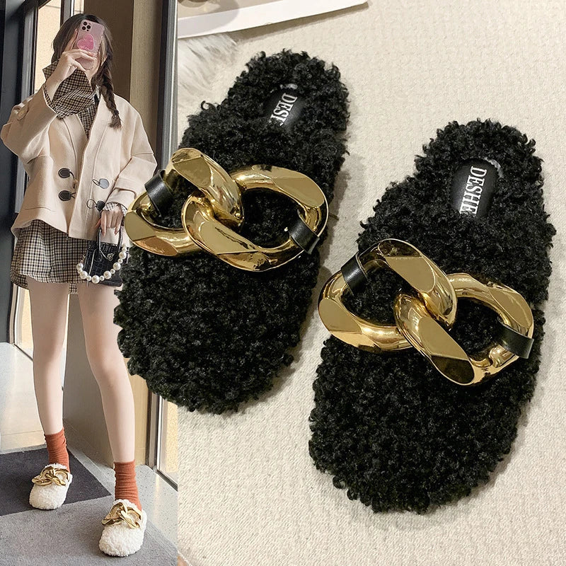 Furry wool mule slippers with a stylish metal chain detail, available in a range of colours to complement any outfit.