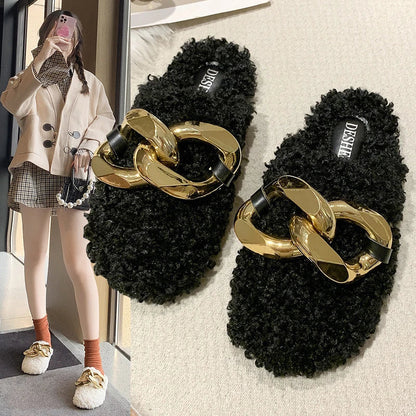 Furry wool mule slippers with a stylish metal chain detail, available in a range of colours to complement any outfit.
