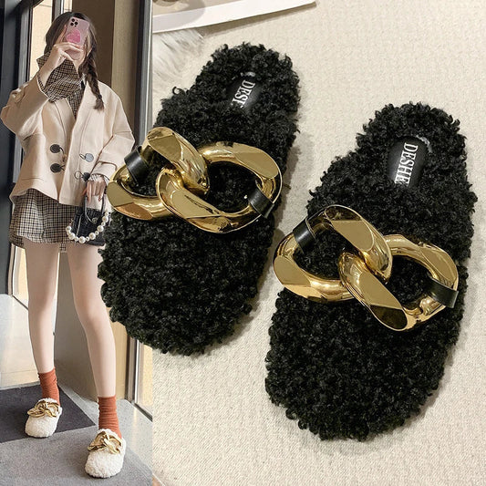 Furry wool mule slippers with a stylish metal chain detail, available in a range of colours to complement any outfit.