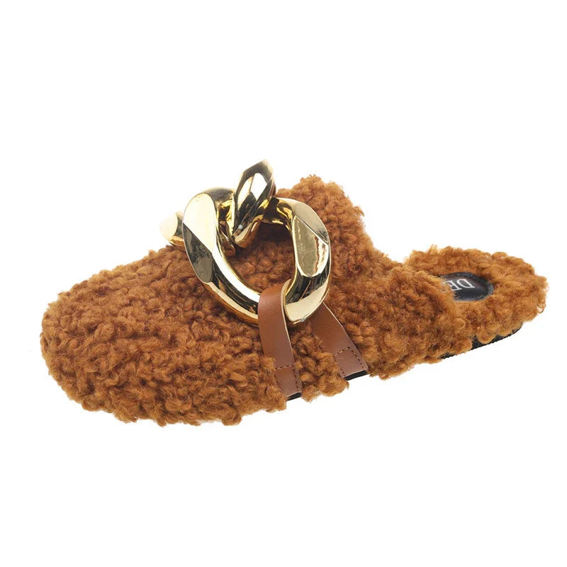 Furry wool mule slippers with a stylish metal chain detail, available in a range of colours to complement any outfit.