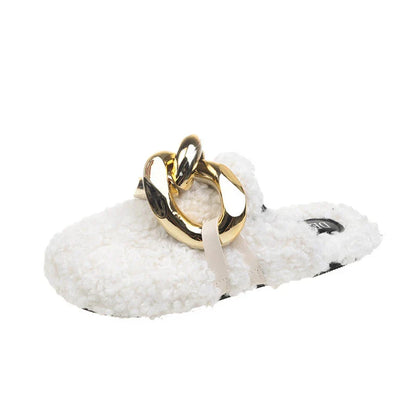 Furry wool mule slippers with a stylish metal chain detail, available in a range of colours to complement any outfit.