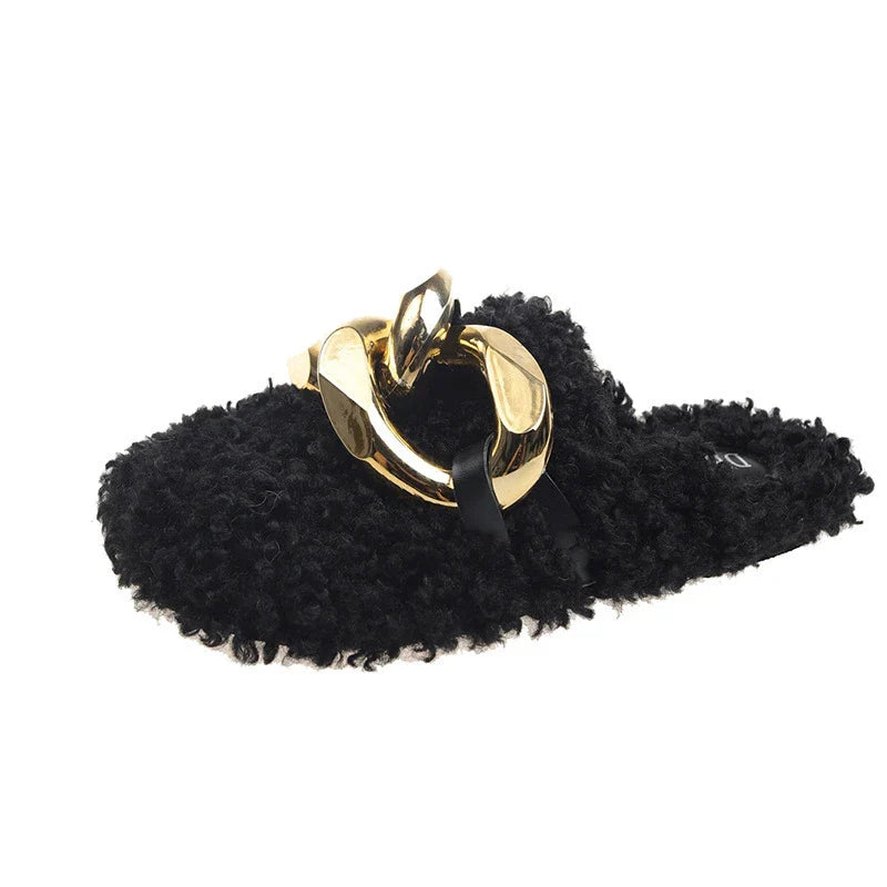 Furry wool mule slippers with a stylish metal chain detail, available in a range of colours to complement any outfit.