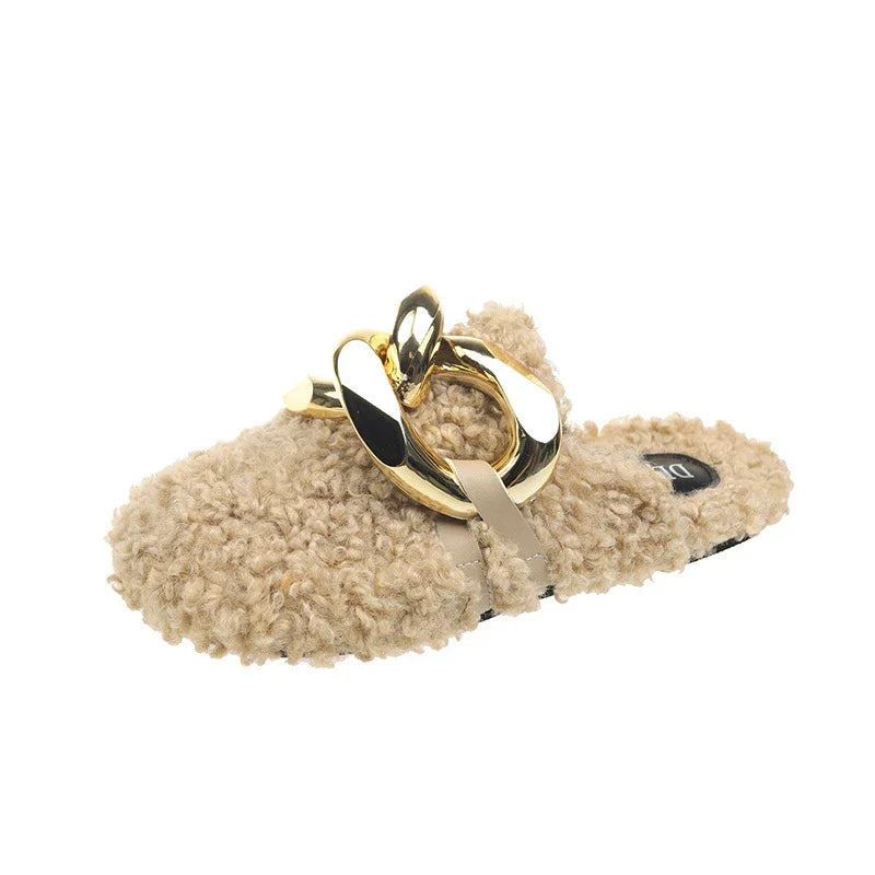 Furry wool mule slippers with a stylish metal chain detail, available in a range of colours to complement any outfit.