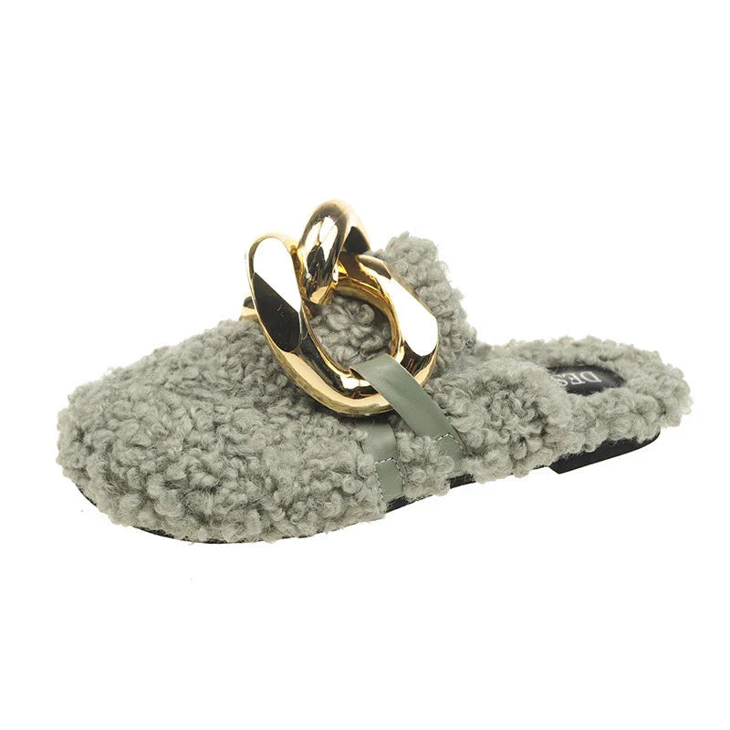 Furry wool mule slippers with a stylish metal chain detail, available in a range of colours to complement any outfit.