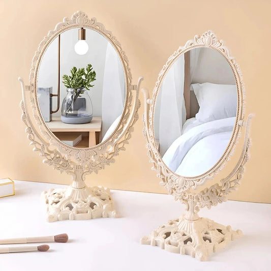 A white, Nordic-inspired decorative makeup mirror with a vintage-style flip design and carved details.