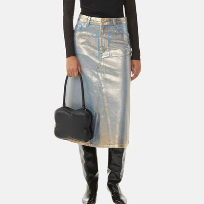 A high-waisted A-line denim skirt with a glossy finish and patchwork pattern, perfect for summer fashion.