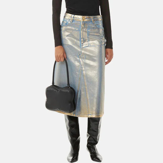 A high-waisted A-line denim skirt with a glossy finish and patchwork pattern, perfect for summer fashion.