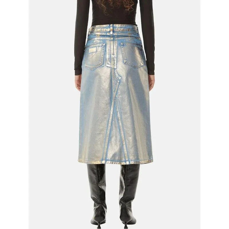 A high-waisted A-line denim skirt with a glossy finish and patchwork pattern, perfect for summer fashion.