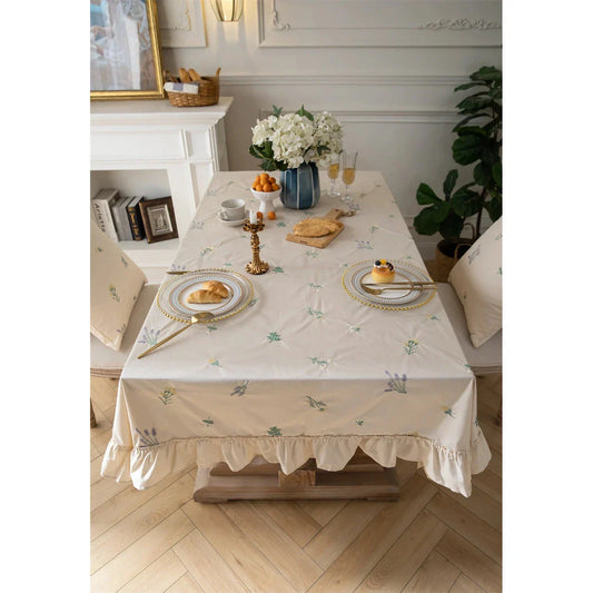 Elegant cotton apricot embroidered tablecloth with a folded lotus leaf edge, adding sophistication to any dining setting.