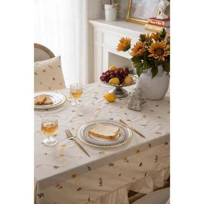 Elegant cotton apricot embroidered tablecloth with a folded lotus leaf edge, adding sophistication to any dining setting.