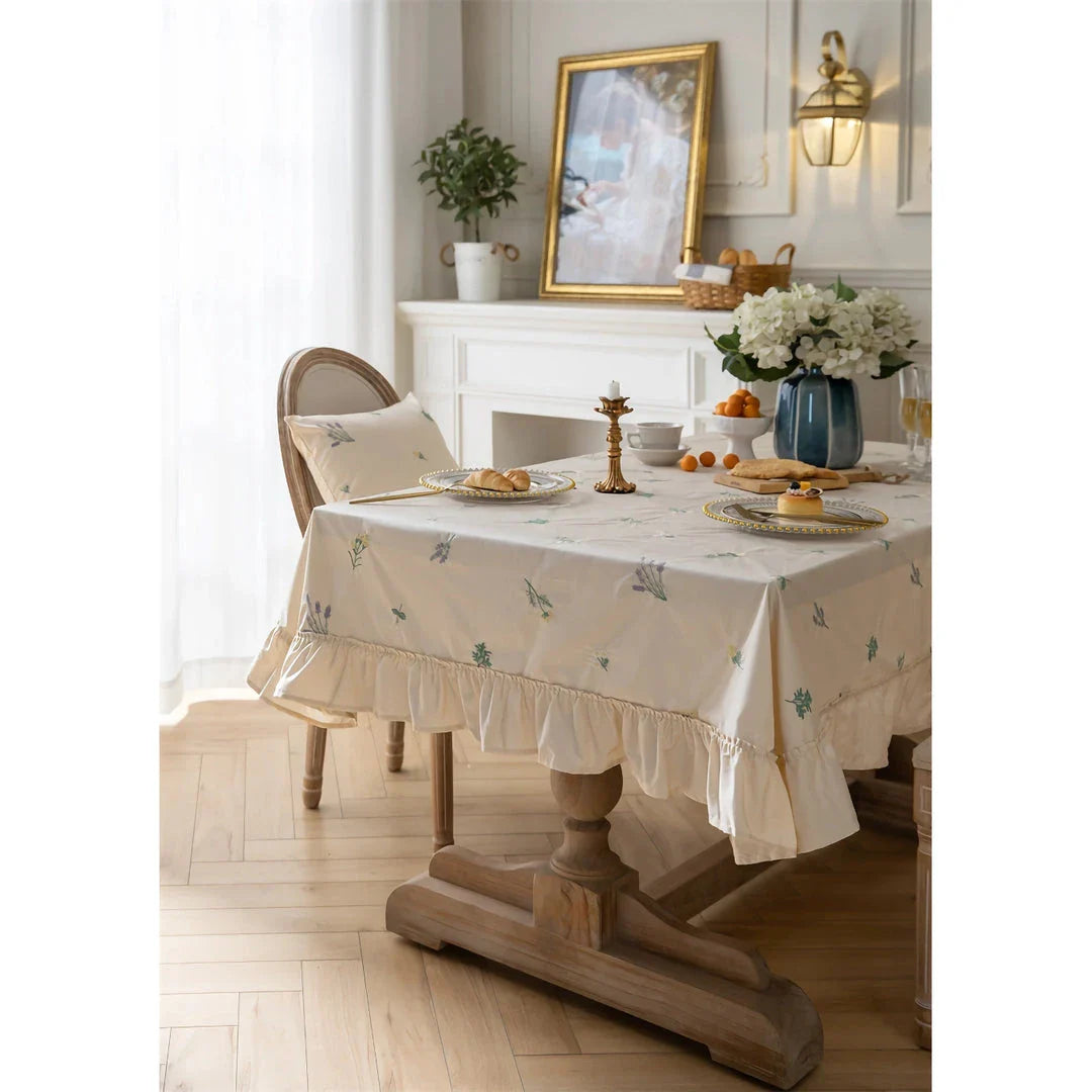 Elegant cotton apricot embroidered tablecloth with a folded lotus leaf edge, adding sophistication to any dining setting.
