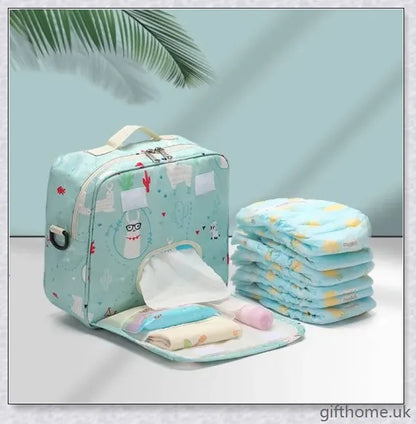 A versatile and stylish baby diaper bag with multiple compartments and soft handles for hands-free carrying.