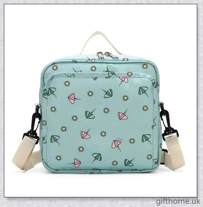 A versatile and stylish baby diaper bag with multiple compartments and soft handles for hands-free carrying.