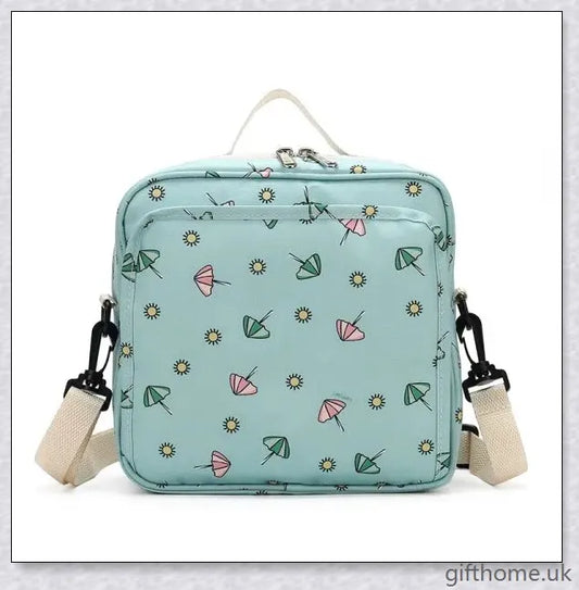 A versatile and stylish baby diaper bag with multiple compartments and soft handles for hands-free carrying.