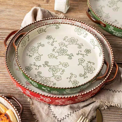 Beautifully hand-painted ceramic baking sheet with a charming cherry blossom design, perfect for even baking and elegant serving.