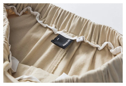Stylish men's drawstring baggy straight trousers in black and milky white colours