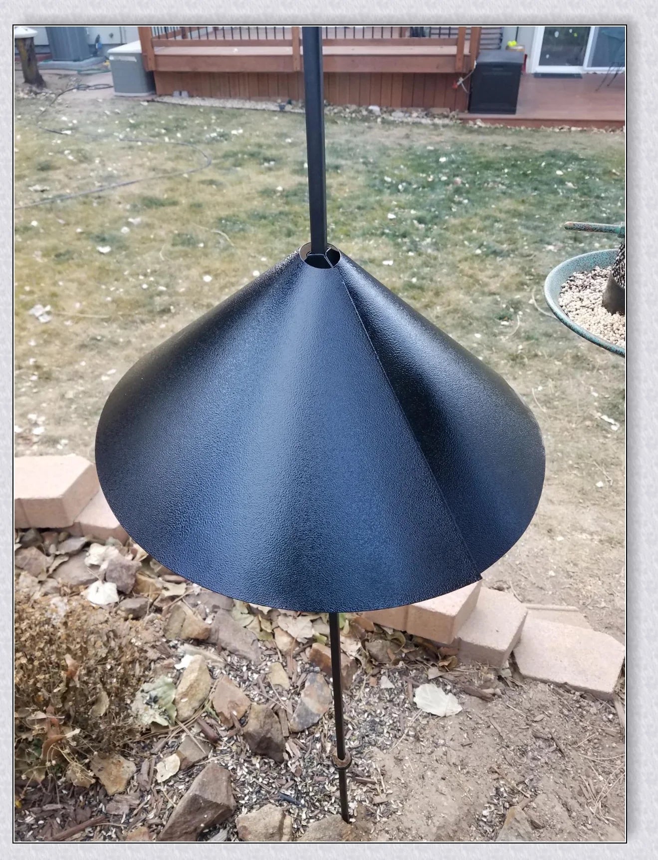 Squirrels Trouble - Squirrel-proof bird feeder accessory with spring-loaded mechanism to deter squirrels