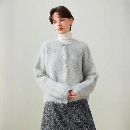 A stylish and cosy alpaca blend cardigan with a sophisticated design, perfect for transitioning between casual and office wear.