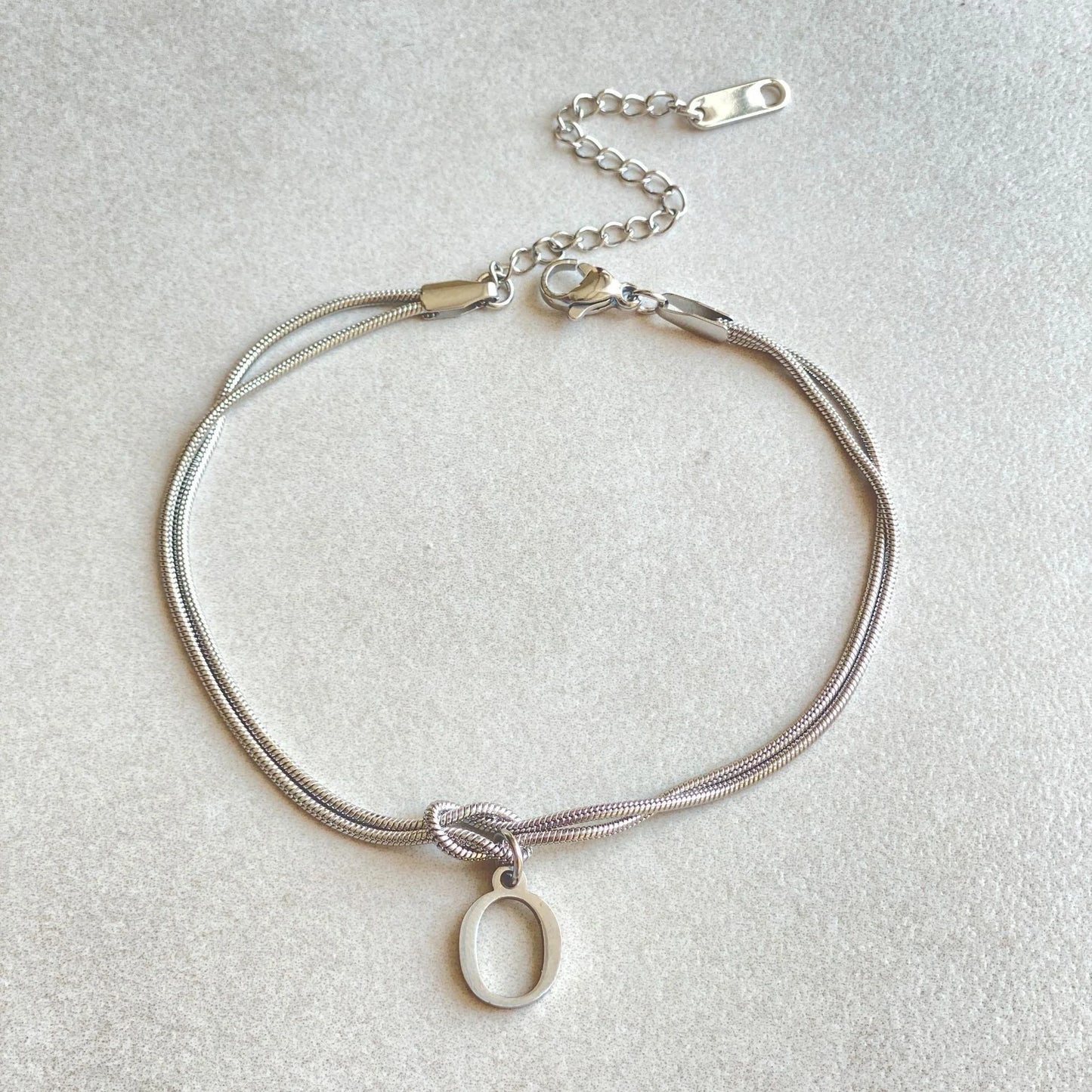 Personalised gold and silver love knot bracelets for couples, perfect as Valentine's Day gifts.