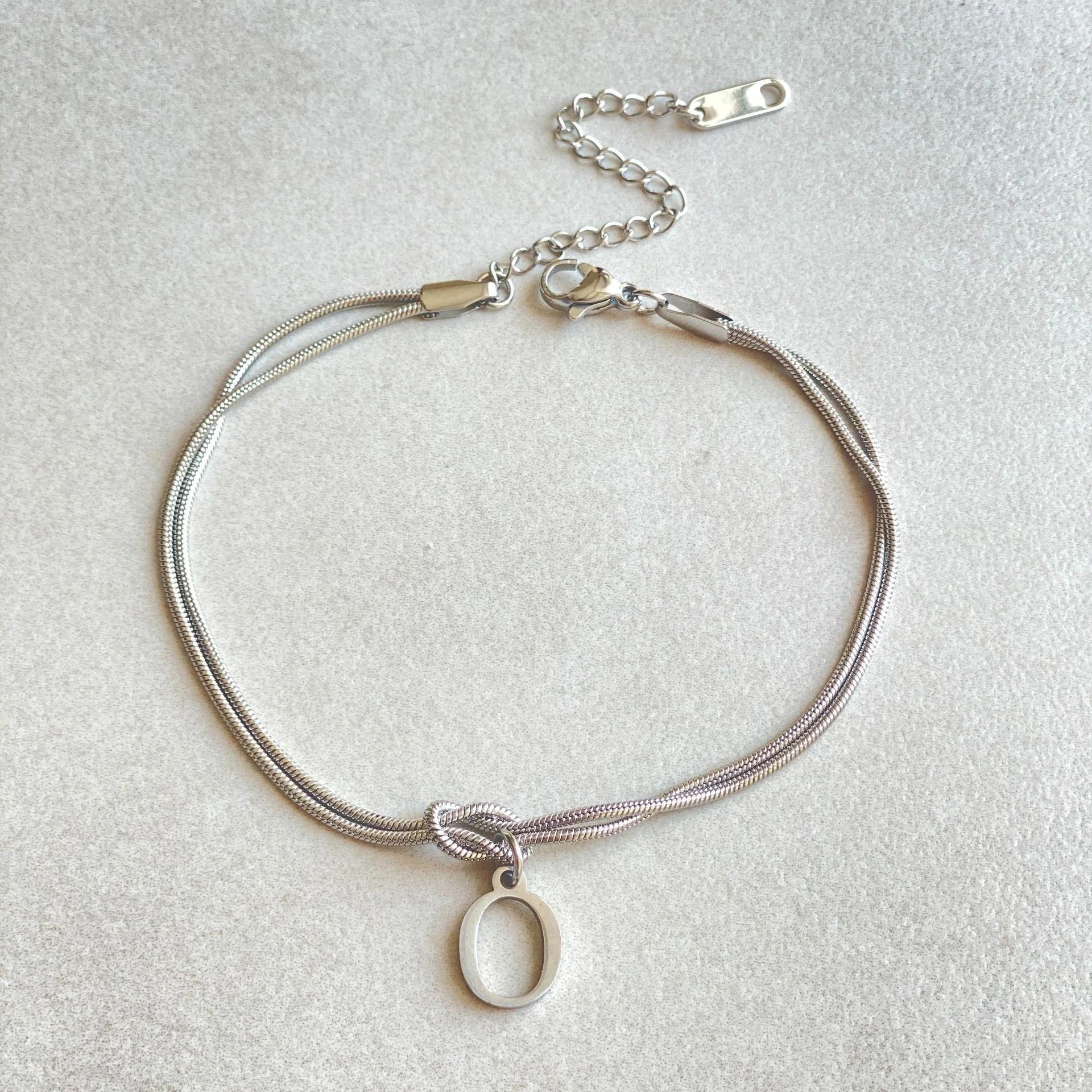 Personalised gold and silver love knot bracelets for couples, perfect as Valentine's Day gifts.