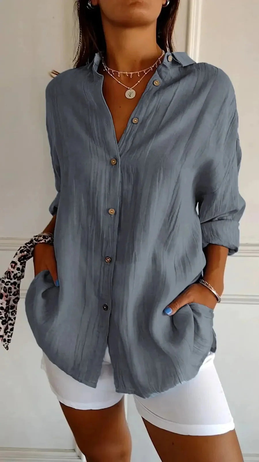 A stylish long-sleeved shirt with a pleated design, available in a variety of colours to suit any occasion.
