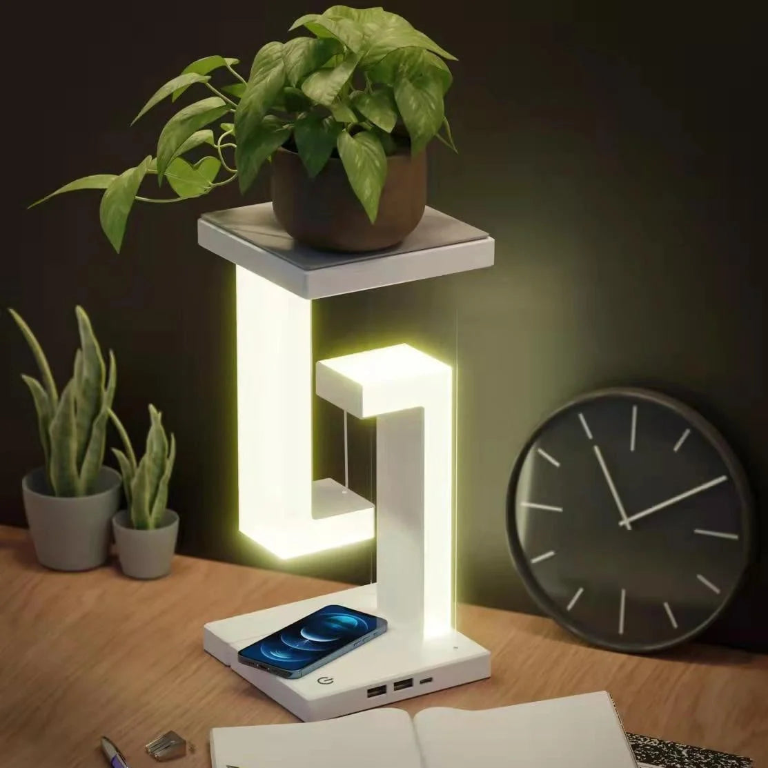 Floating table lamp with wireless charging for smartphones in modern minimalist design