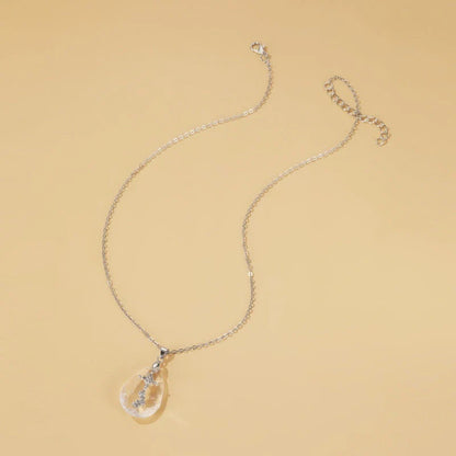 Elegant white drop pendant necklace with cross-chain design, made of premium electroplated alloy for a timeless and sophisticated look.