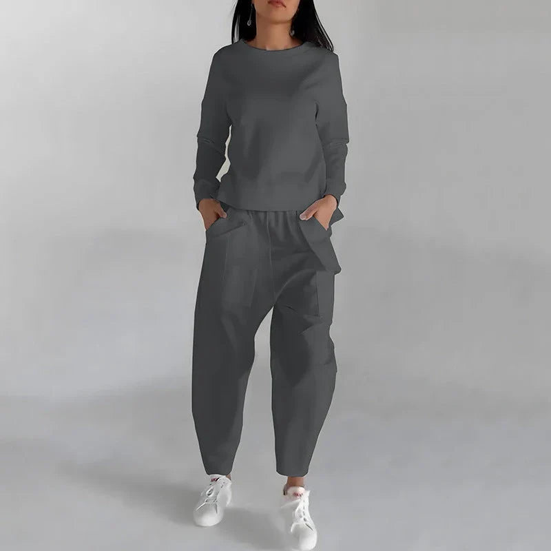 Stylish polyester sweatshirt with back slit, pockets, and available in various colors