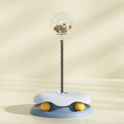 Interactive cat toy with treat dispenser and spring ball in blue, yellow, green
