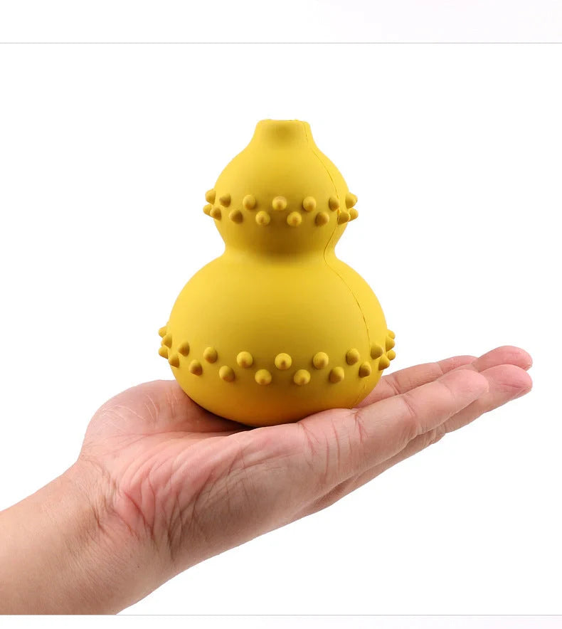 A durable, interactive dog toy made of natural rubber that dispenses treats as the dog plays with it