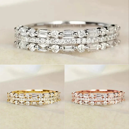 Elegant multilayer ring with a subtle geometric design, available in platinum, gold, and rose gold colours