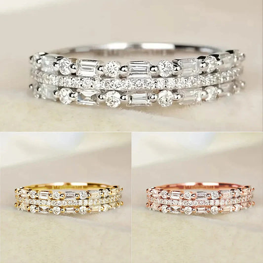 Elegant multilayer ring with a subtle geometric design, available in platinum, gold, and rose gold colours