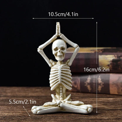 Haunting Halloween desktop ornaments, featuring intricate resin skulls and skeletons in black and vintage white finishes