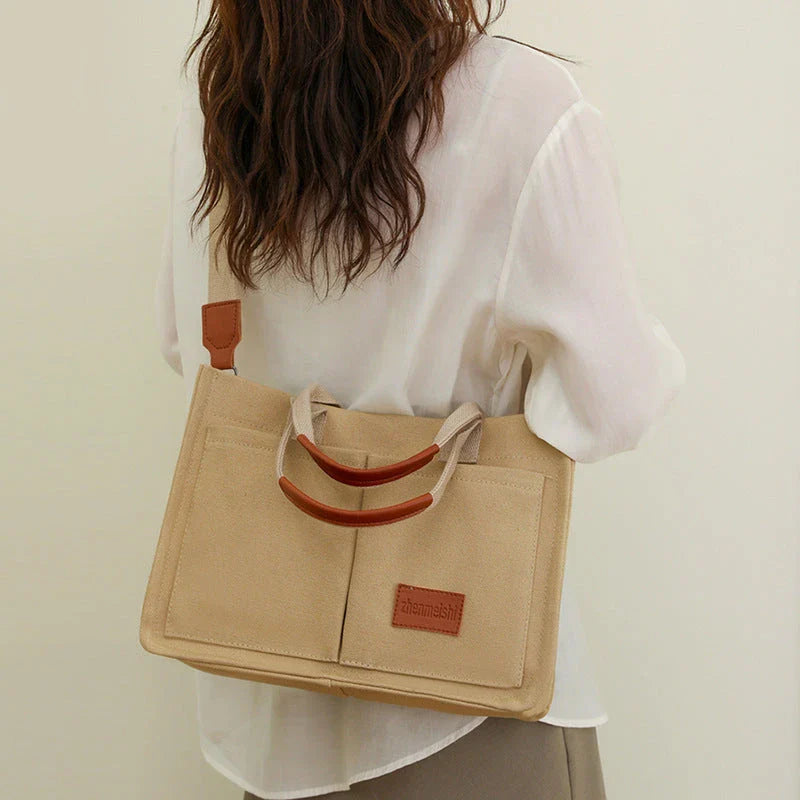 Stylish and durable canvas tote bag with multiple pockets for everyday use