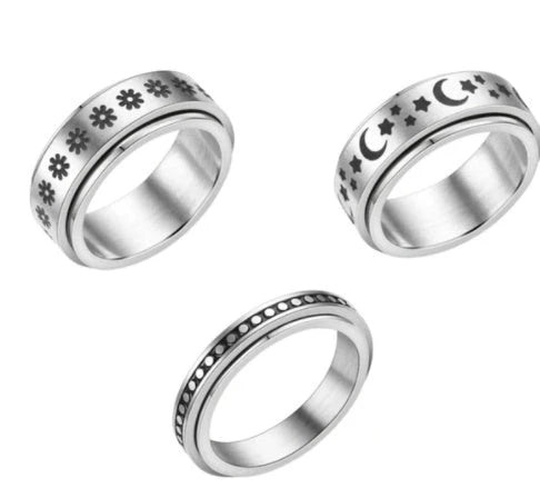 Titanium steel rings with captivating celestial designs including stars, moons, and floral motifs