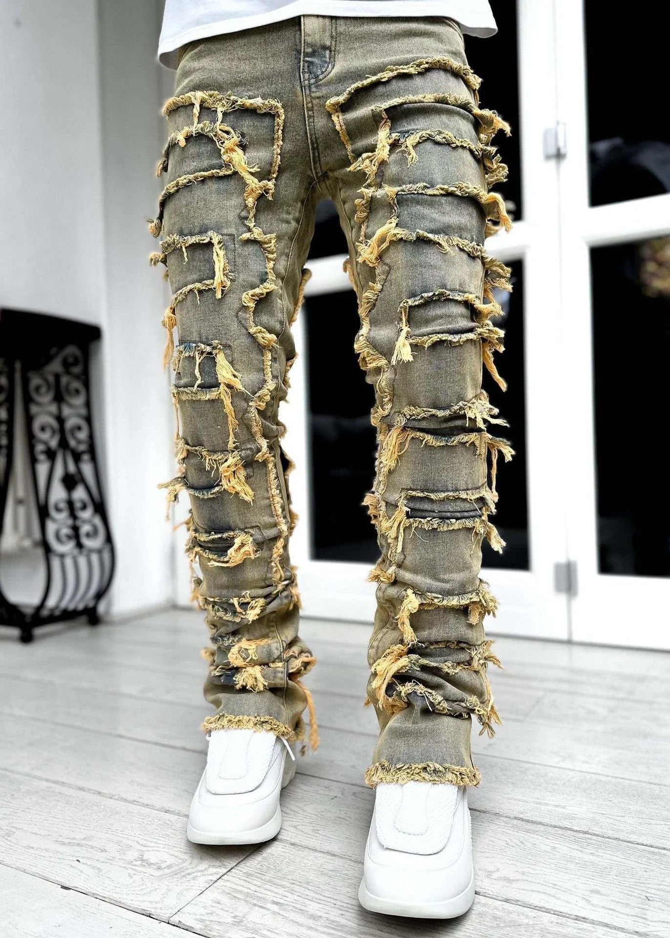 Stylish patched jeans with tight fit and stacked leg design in a variety of fashionable colors