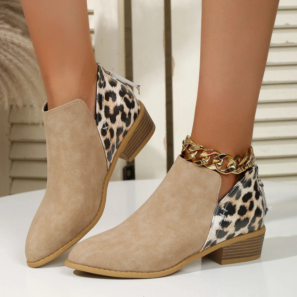 Women's leopard print boots with pointed toe and chunky heel, available in multiple sizes