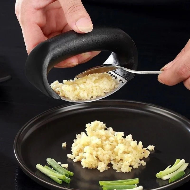 Stainless steel garlic press with ergonomic handle for easy mashing