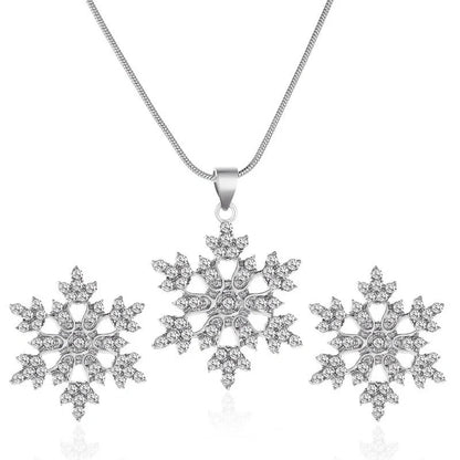 Elegant snowflake jewellery set with necklace, earrings and pendant in gold and silver tones