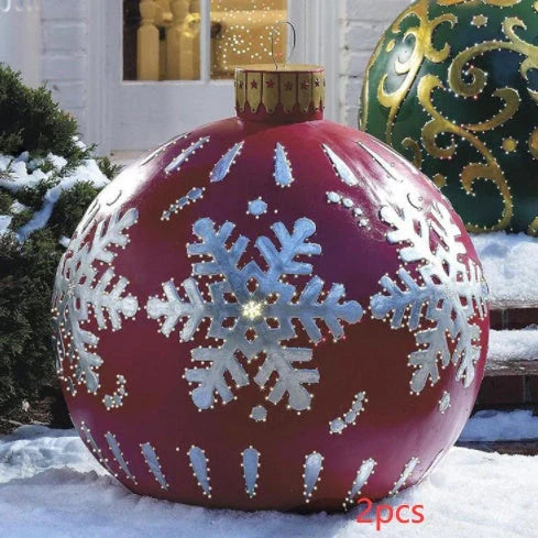 Inflatable Christmas baubles in various festive designs for outdoor holiday decoration