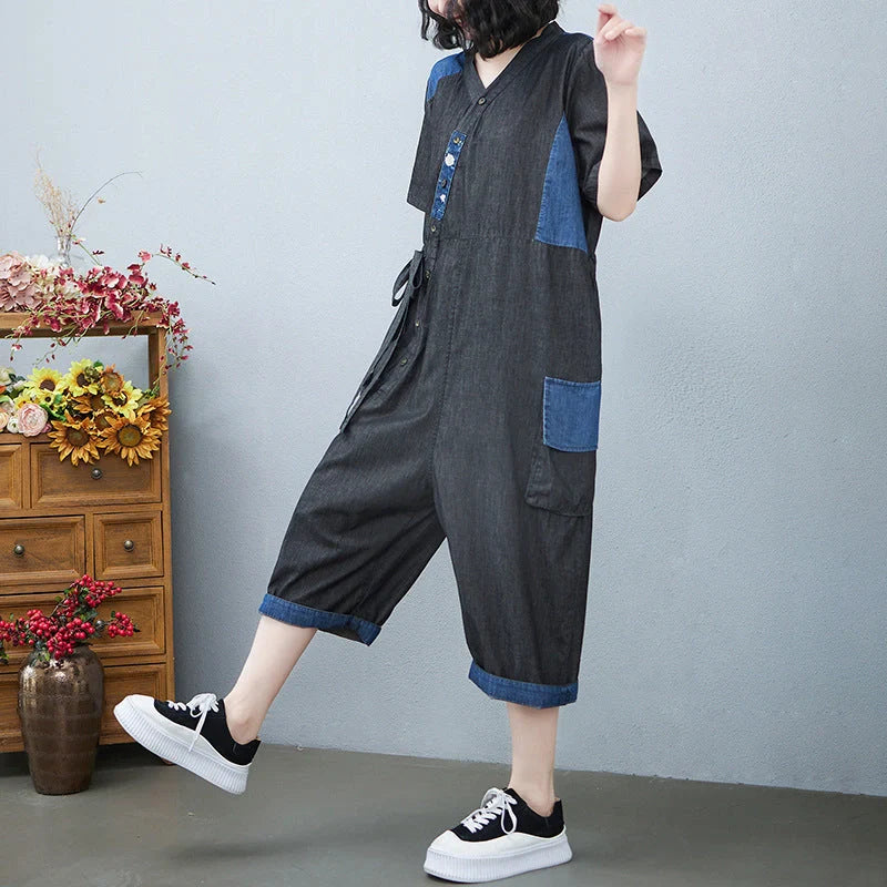 Women's denim drawstring jumpsuit with wide legs and cropped length, available in blue and black colours
