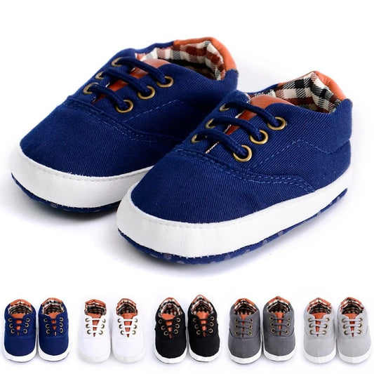 Solid colour baby canvas shoes with soft bottom and front strap in sizes 11cm to 13cm